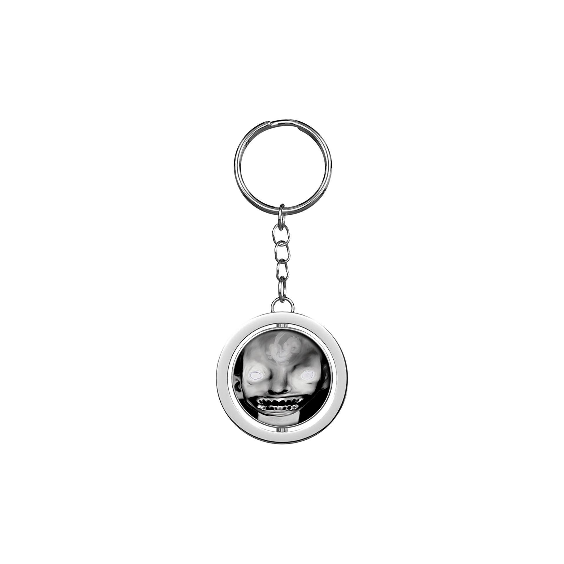 A keyring with a circular charm featuring a black and white image of a person's face