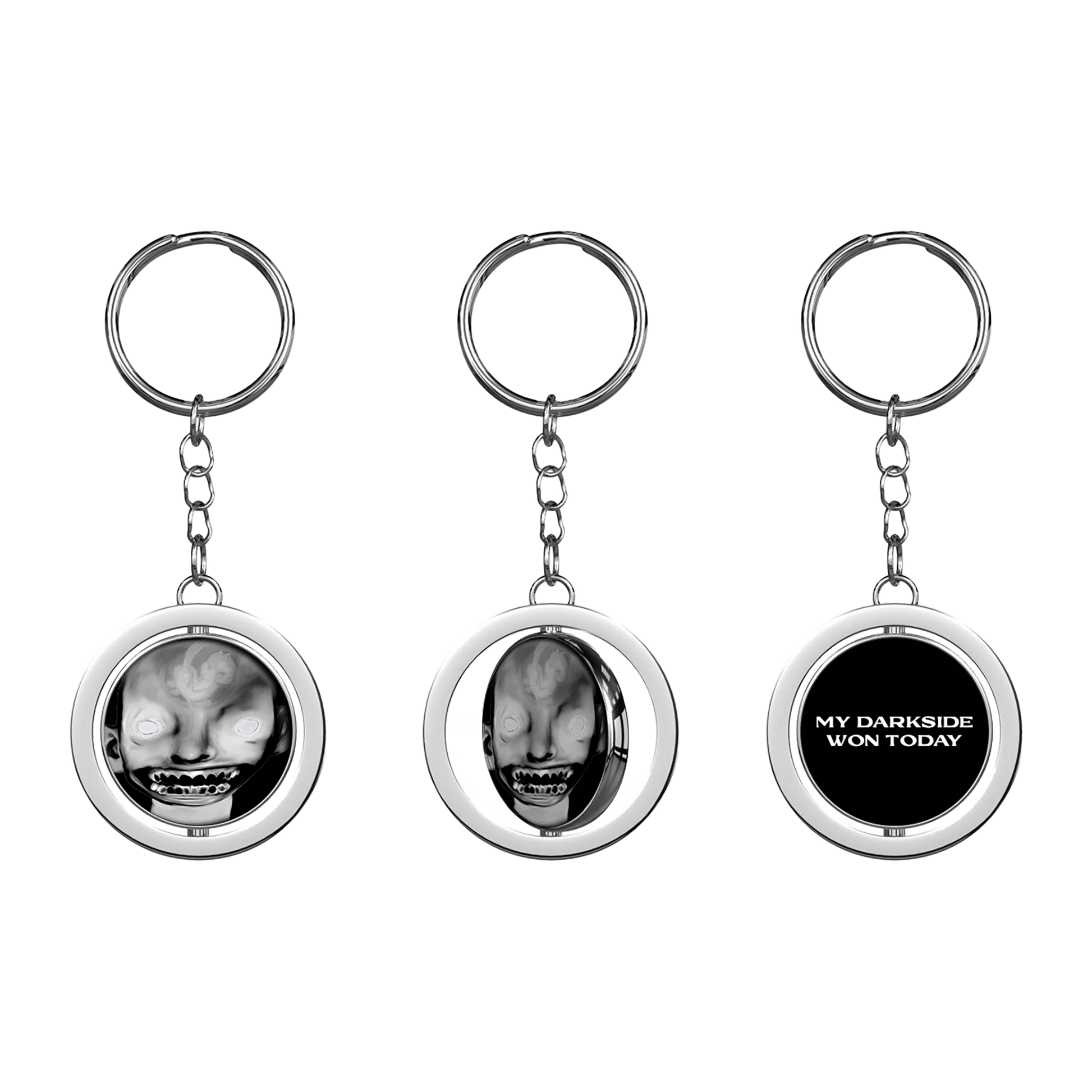A keyring with a circular charm featuring a black and white image of a person's face