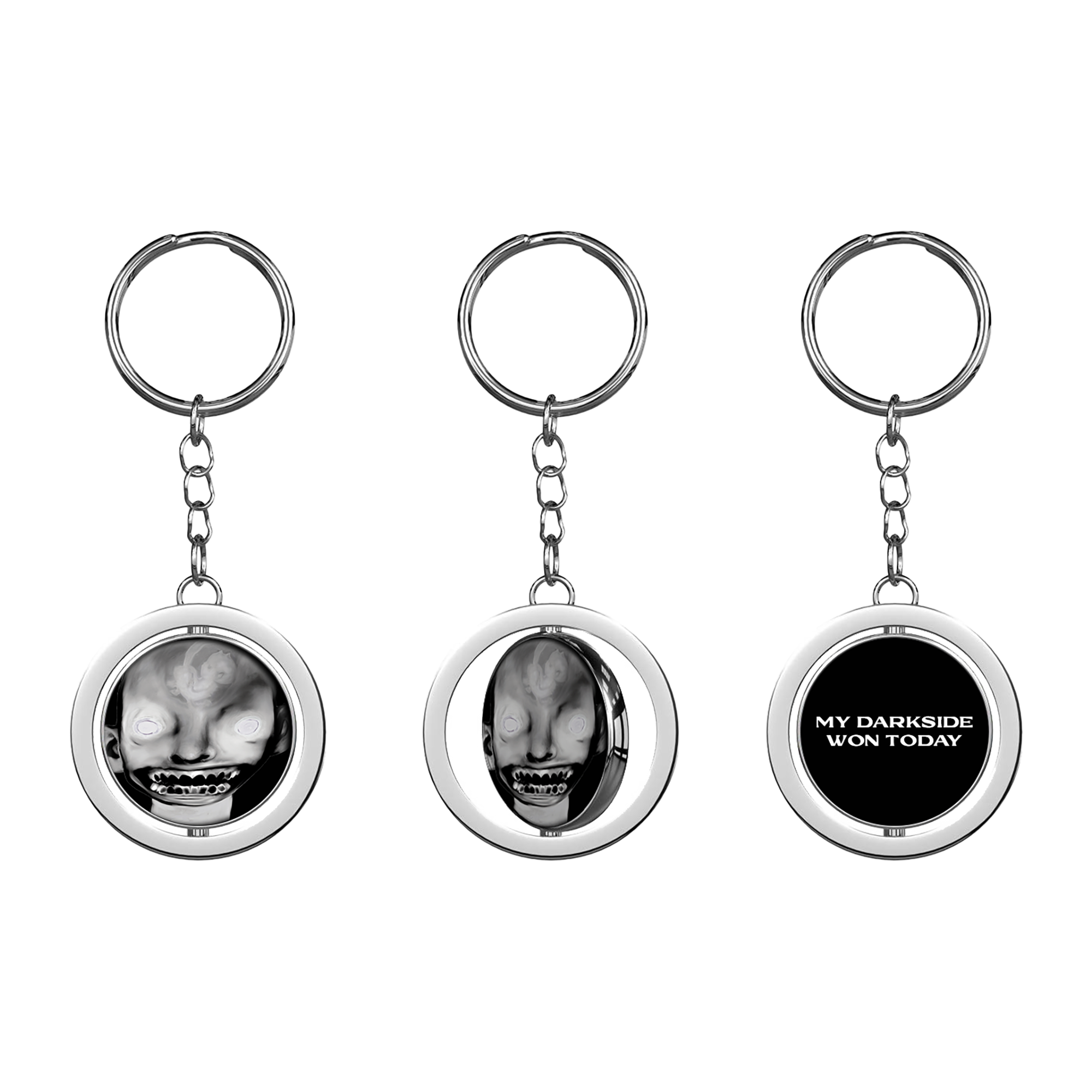 A keyring with a circular charm featuring a black and white image of a person's face